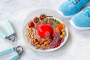 Cholesterol diet concept with Less fat food in plate with heart object