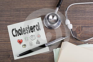 Cholesterol, Workplace of a doctor. Stethoscope on wooden desk background