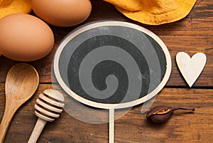 Cholkboard Topper for Text Mesage or Food Blog. . Cooking Process, Food and Recipe Concept. Orange Napkin, Eggs, Heart