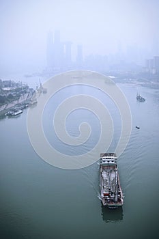 Transport ships passing the Yangtze River in fog photo