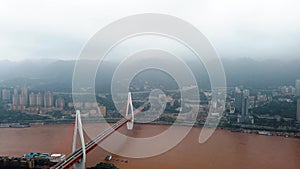 Chongqing skyline and Chaotianmen bridge over Yangtze river in China time lapse