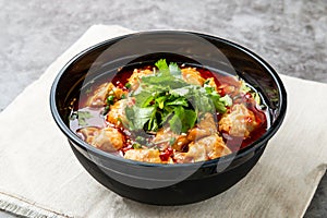 Chongqing Spicy Wonton Soup served in dish isolated on wooden table side view of hong kong fast food