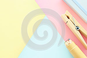 chool or office supplies, back to school over pastel background template.