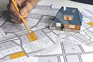 Choose a building plot of land for house construction on cadastral map
