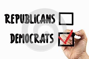Choose between Democrats and republicans with checkbox. Doodle  on a whiteboard, written with black and red marker in a hand. photo