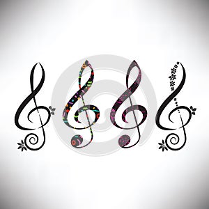 Choose from four assorted decorative G clefs photo