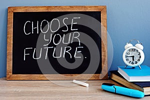 Choose your future written on a blackboard