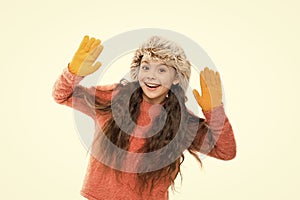 Choose your winter. small girl earflap hat and gloves. her favorite knitted sweater. active healthy childhood. winter