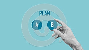 The choosing of business plan b out of two options on blue background. Proceed to plan B. Use a second chance