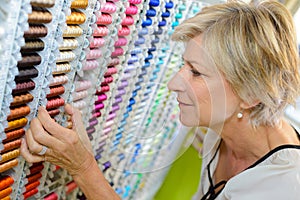 Choosing cotton at haberdashery store