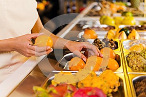 Choosing the freshest fruits.