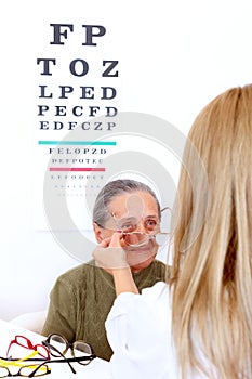 Choosing glasses at the optician