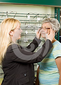 Choosing glasses at the optician photo