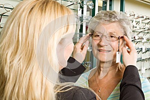 Choosing glasses at the optician photo