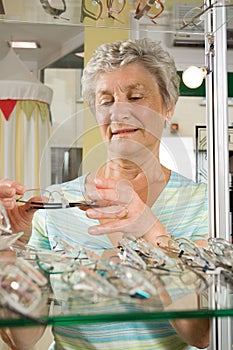 Choosing glasses at the optician photo