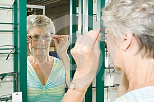 Choosing glasses at the optician photo