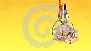 Choosing real estate and mortgage concept. Machine claw with house on yellow background