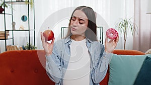 Choosing right nutrition pregnant woman comparing choosing between sweet donut and ripe apple