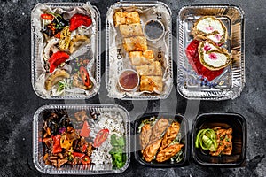 Choosing take away food. Spring rolls, dumplings, gyoza and dessert in lunch box. Take and go organic food. Thai and Asian