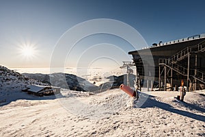 Chopok in Low Tatras national park with mountain hut and Jasna ski resort cableway station in winter. Liptov region. Demenovska wa