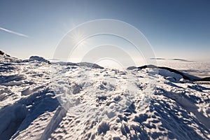 Chopok in Low Tatras national park with mountain hut and Jasna ski resort cableway station in winter. Liptov region. Demenovska wa