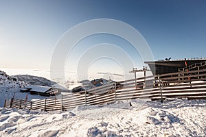 Chopok in Low Tatras national park with mountain hut and Jasna ski resort cableway station in winter. Liptov region. Demenovska wa