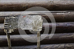 Chopped back of old stool behind the old wooden building. Top view.