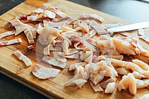 Chopped bacon on a wooden board