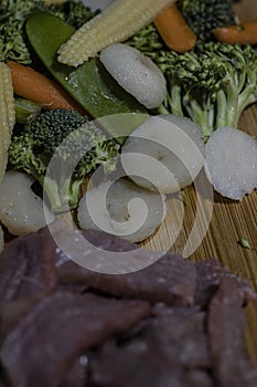 Chopped beef and vegetables for stir fry.