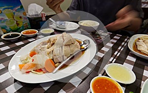 Chopped boiled chicken with oily rice to be served in a restaurant