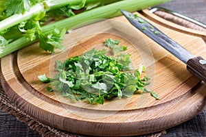Chopped celery greens on a cutting board