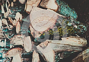Chopped firewood on a stack, prepared for winter. Photo depicts