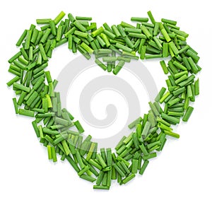 Chopped fresh green onions isolated on white background,Heart-shaped,Copy space
