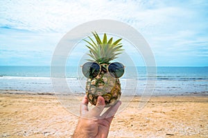 Chopped fresh pineapple with sunglasses