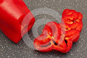 Chopped fresh red bellpepper on marble cutting board