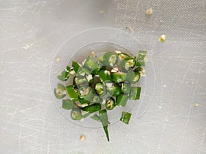 Chopped green chillies with seeds top angle close up