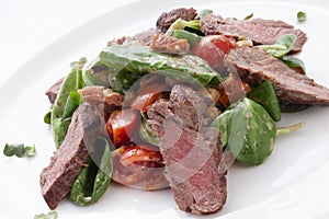Chopped meat with salad in a plate