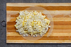 chopped potato in wooden base