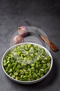 Chopped raw bhindi or okra in a bowl