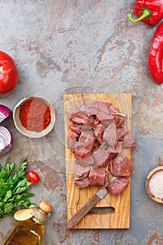 Chopped raw meat with vegetables and herbs, ready to cook