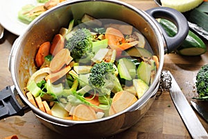 Chopped raw vegetables in pressure cooker photo