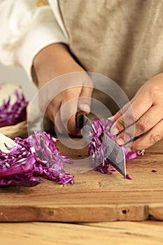 Chopped red cabbage close-up on kitchen board