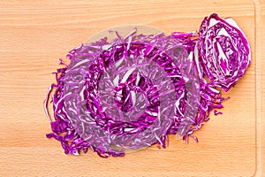 Chopped red cabbage on wooden cutting board. 9