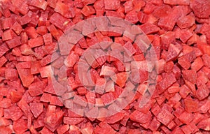 Chopped red carrot pieces closeup