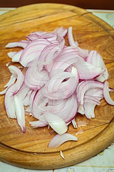 Chopped red onions on board