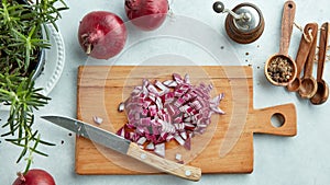 Chopped red onions on wooden cutting board