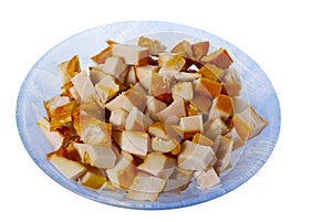 Chopped smoked chicken meat in the plate isolated