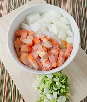 Chopped Tomatoes, Onions and Scallion on Cutting Board