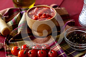 Chopped tomatoes on a red background. Vegetarian food