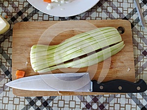Chopped vegetables on a cutting table, zucchini, carrots, onions